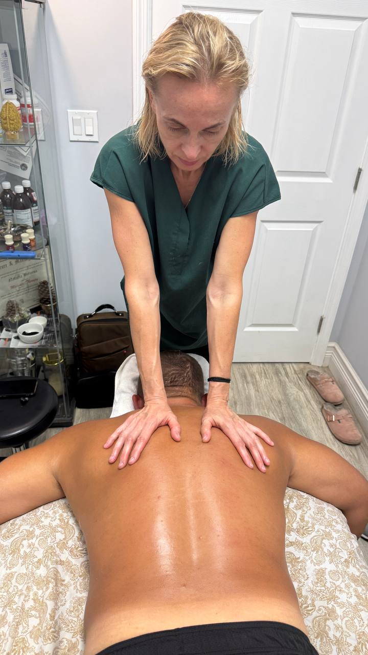 Natalia providing focused back massage
